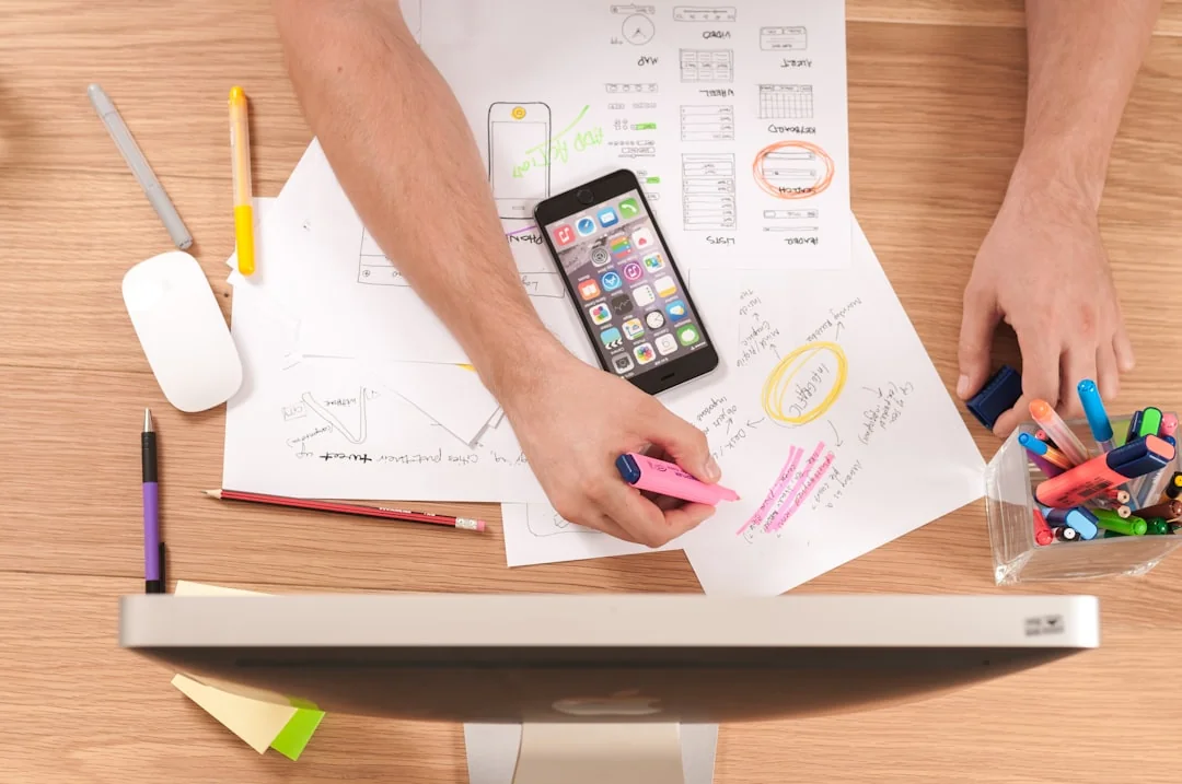 Overhead shot of diverse team analyzing marketing strategies with charts and graphs.